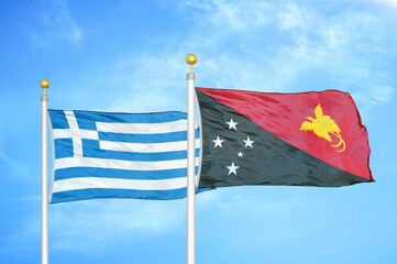 Greece and Papua New Guinea two flags on flagpoles and blue sky