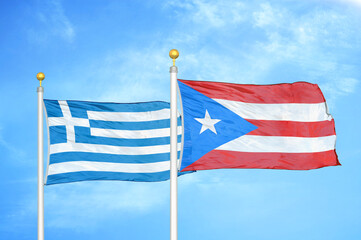 Greece and Puerto Rico two flags on flagpoles and blue sky