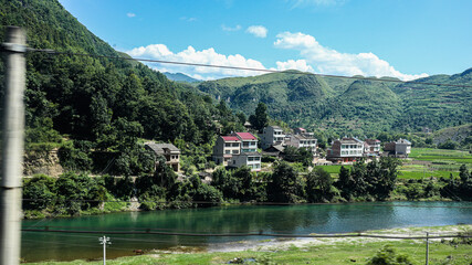 Fototapeta premium Chinese rural village at the foot of a mountain