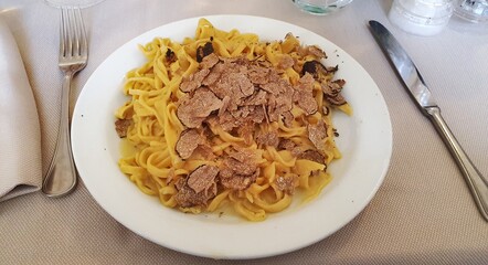 Plate of tagliatelle al tartufo, delicious type of Italian pasta.