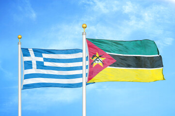 Greece and Mozambique two flags on flagpoles and blue sky