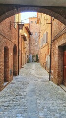 Hisyorical narrow street of Città della Pieve, a Medieval city that dominate up Val di Chiana at the border of Umbria and Tuscany in Italy.