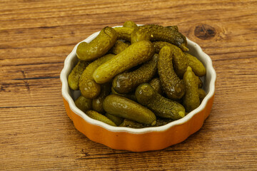 Pickled gherkin in the bowl