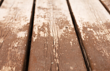 Old dry peeling planks of a street bench