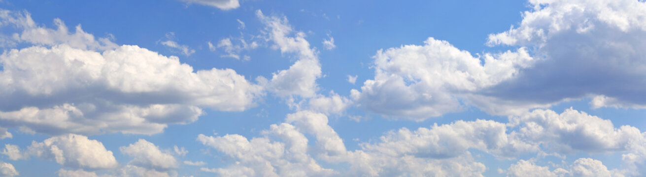 Blue sky and clouds, blue sky, panoramic view. Many cumulus clouds in the daytime sky. Sky panorama.