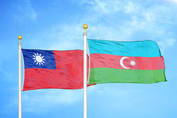 Taiwan and Azerbaijan two flags on flagpoles and blue sky