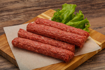 Raw beef sausages with spices