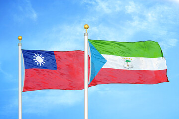 Taiwan and Equatorial Guinea two flags on flagpoles and blue sky