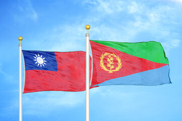 Taiwan and Eritrea two flags on flagpoles and blue sky