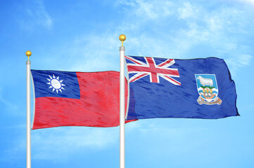 Taiwan and Falkland Islands two flags on flagpoles and blue sky