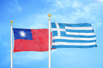 Taiwan and Greece two flags on flagpoles and blue sky