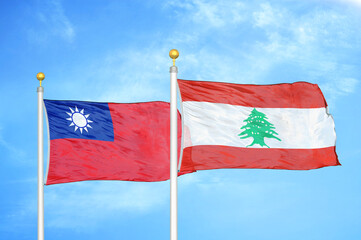 Taiwan and Lebanon two flags on flagpoles and blue sky