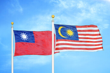 Taiwan and Malaysia two flags on flagpoles and blue sky