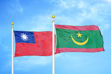 Taiwan and Mauritania two flags on flagpoles and blue sky