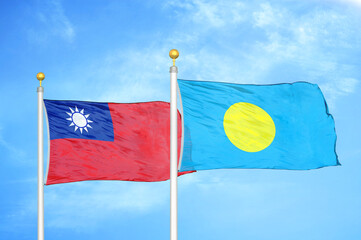 Taiwan and Palau two flags on flagpoles and blue sky