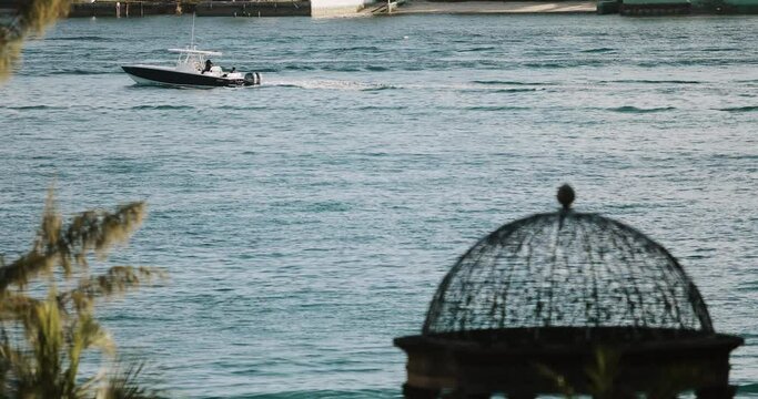 The boat swims from right to left in Venice or Los Angeles or London 4k slow motion