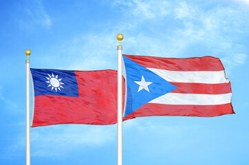 Taiwan and Puerto Rico two flags on flagpoles and blue sky