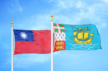 Taiwan and Saint Pierre and Miquelon two flags on flagpoles and blue sky