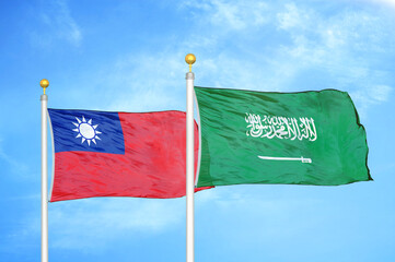 Taiwan and Saudi Arabia two flags on flagpoles and blue sky