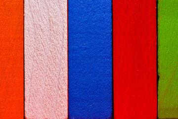 colorful cubes lined up in a row in the form of a fence