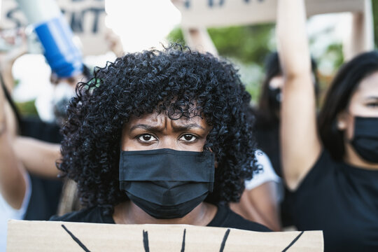 Young Afro Woman Activist Protesting Against Racism And Fighting For Equality - Black Lives Matter Demonstration On Street For Justice And Equal Rights