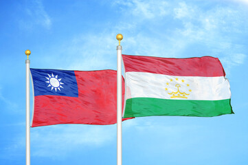 Taiwan and Tajikistan two flags on flagpoles and blue sky