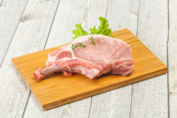 Raw pork bone steak over wooden