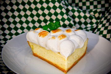Meringue lemon tart slice in a plate 