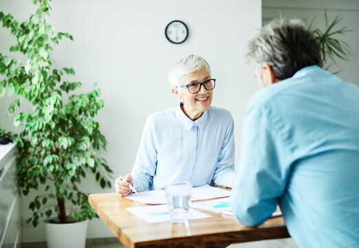 business office discussion teamwork senior meeting businesswoman colleague woman vitality elderly