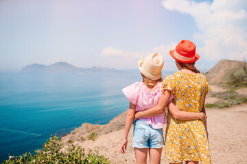 children on vacation on white rock background