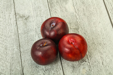Ripe sweet plum fruit heap