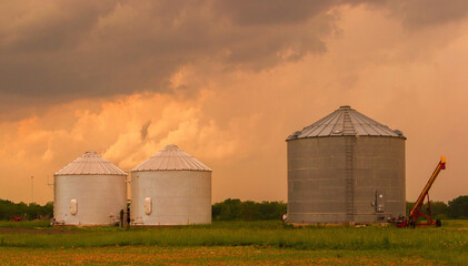 Rural farm under orange skies.