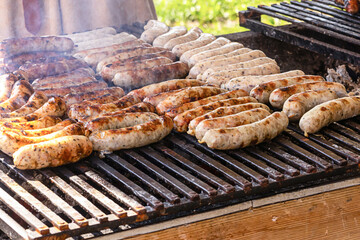 Bavarian white sausage fried pork on the barbecue grill picnic