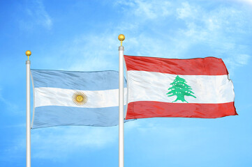 Argentina and Lebanon two flags on flagpoles and blue sky