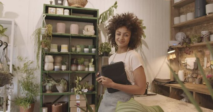Portrait of Small business entrepreneur afro American female Store Owner looking at camera in shop