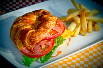 Organic turkey croissant and french fries
