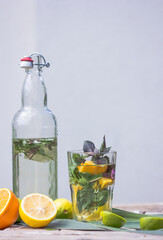 Basil smash gin alcoholic cocktail with fresh basil leaves and citrus.