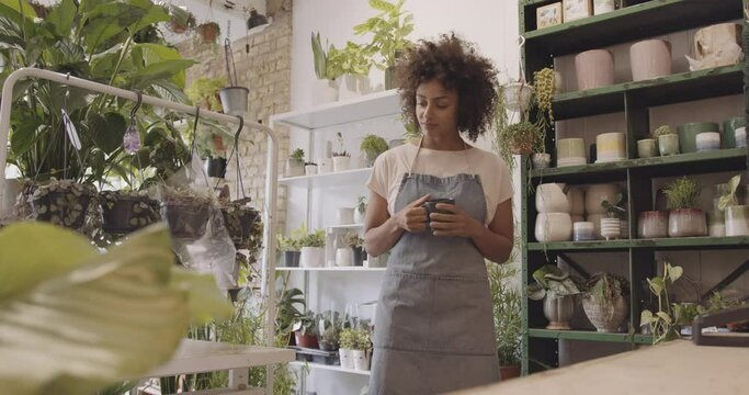 Small business entrepreneur afro American female Store Owner having a coffee break