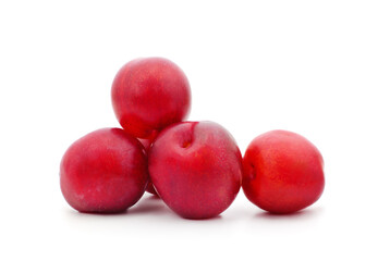 Blue plums with leaves.