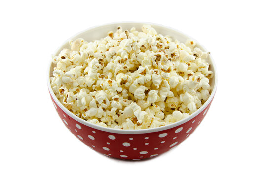 Salted Popcorn In A Red Plate With Polka Dots. Isolated On White Background No People. Close-up, Side View.