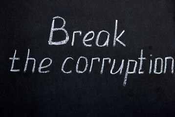 
Chalkboard lettering Break the corruption. A call to tackle social problems