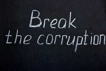 Obraz premium Chalkboard lettering Break the corruption. A call to tackle social problems