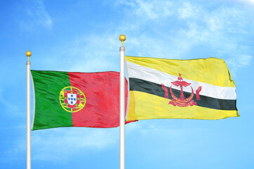 Portugal and Brunei two flags on flagpoles and blue sky