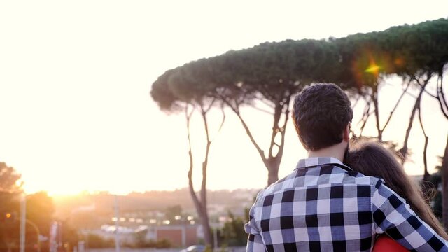back view of romatic couple embraced  with the panorama in the background