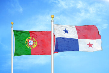 Portugal and Panama two flags on flagpoles and blue sky