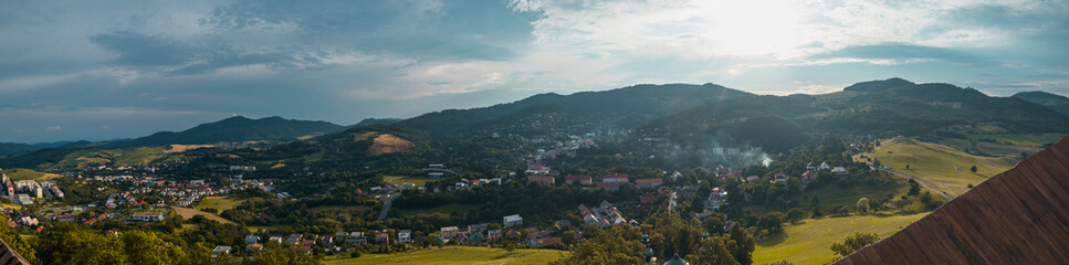 Fototapeta na wymiar Panorama from the top of Banska Stiavnica Cavalry in central Slovakia during afternoon hours with overview of the city.