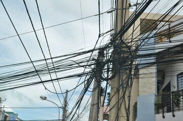 high voltage power lines on blue sky