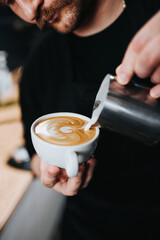 The art of barista in making coffee - professional brewing on expensive equipment