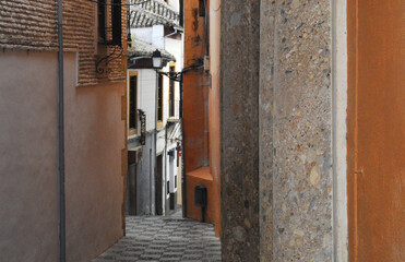 Fototapeta premium Spain- Granada- A Narrow Passageway Through Old Town