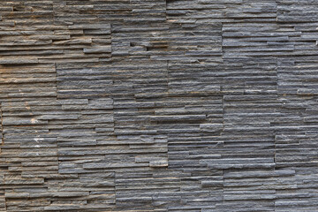 solid stone pattern of dark slate, background ribbed horizontal stripes